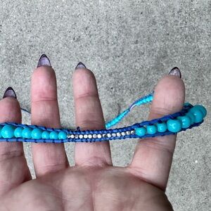 Beaded necklace/bracelet with a button clasp.